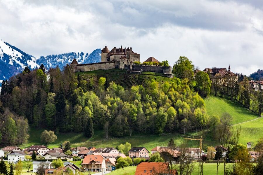 Bern: Gruyères Cheese and Cailler Chocolate Tasting Tour - Entering the 13th-century Gruyères Castle