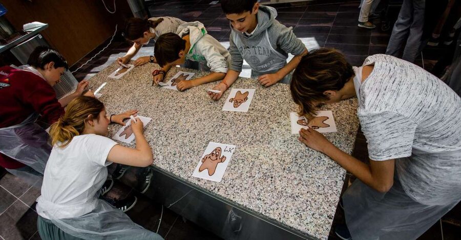 Bruges: Chocolate Making Workshop and Chocolate Museum Entry - Choosing toppings and making your designs