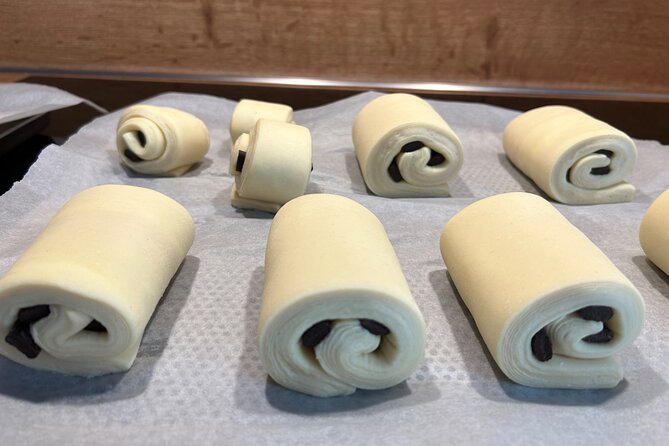 Croissants and pains au chocolat with a pastry chef in Paris - Shaping croissants and pains au chocolat