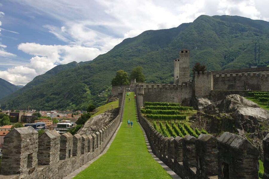 From Milan: Lugano, Bellinzona and Chocolate Factory Trip - Transport, timing, and physical demands