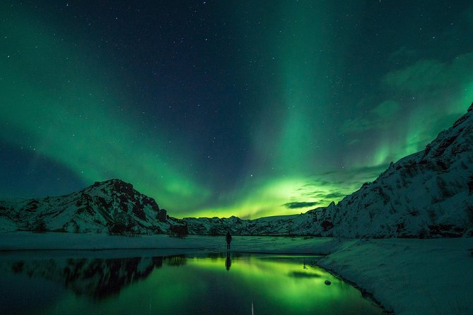 Northern Lights Small-Group Tour with Hot Chocolate & Photos - Chasing breaks in the clouds
