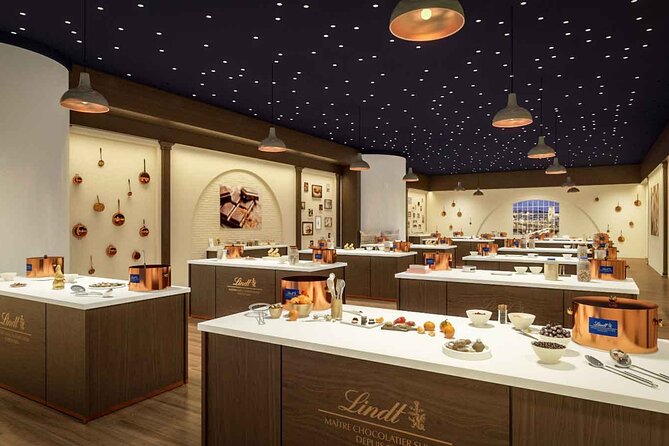 Tour in Lindt Home of Chocolate Museum From Zurich With pickup - See chocolate being made through panoramic windows