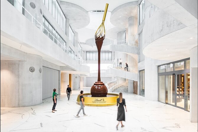 Tour in Lindt Home of Chocolate Museum From Zurich With pickup - The nine-meter chocolate fountain sets the mood