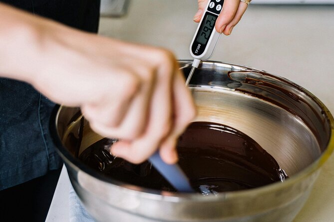 Unique Belgian Chocolate Making Workshop in Bruges - Filling the chocolates with ganache and flavors