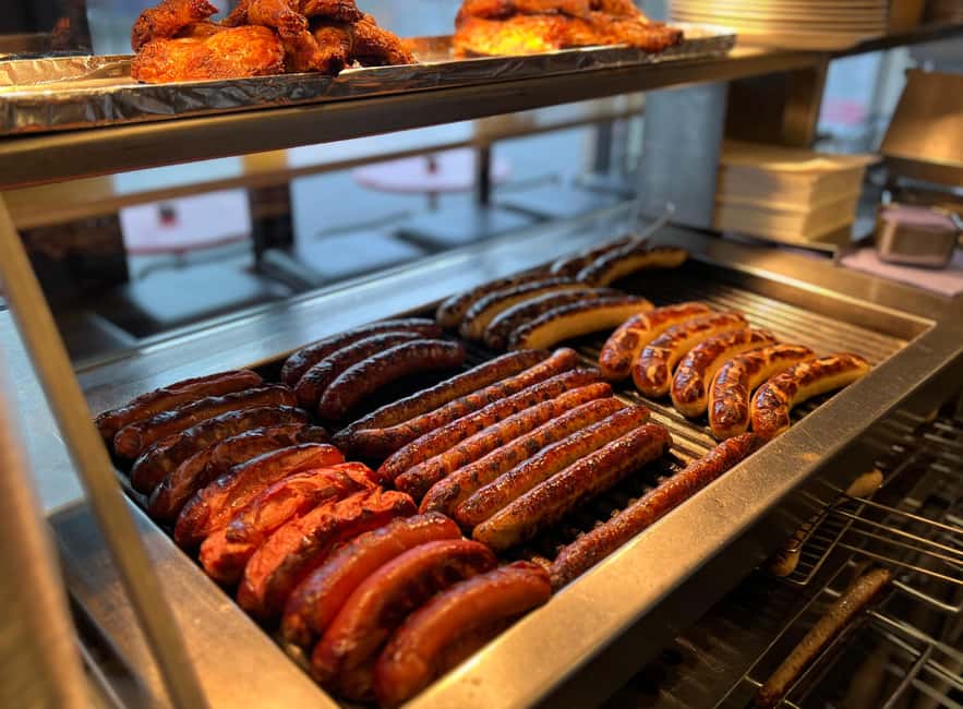 Zurich: Food Tour of 8+ Tastings with Cheeses & Chocolates - Zurich sausage, sauerkraut, and mustard